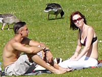 Sexy tattooed bimbo was spied in the park getting suntanned and flashing the beautiful bikini bra down blouse view